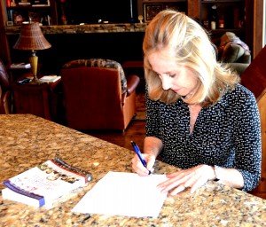 Joanie Holzer Schirm signing Prague's Triton publishing company contract for Adventurers Against Their Will to be in Czech language. March 2014
